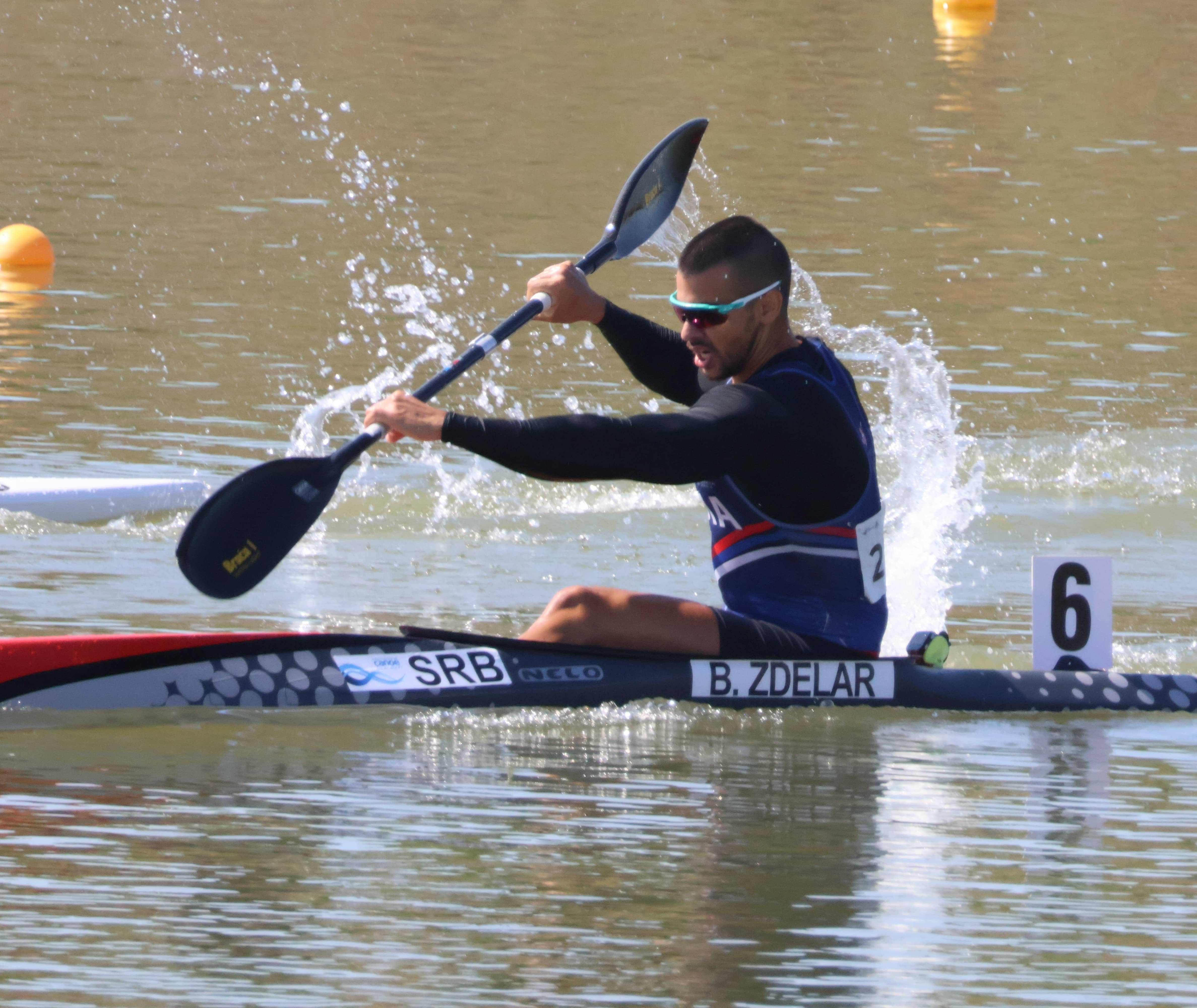 Bojan Zdelar racing in his kayak for Serbia